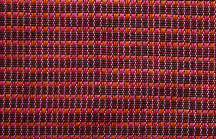 Woven cushion ABILITY (wine red, pink, orange)